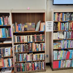 Hawaii State Public Library System - McCully-Moiliili Library - Don't want to deal with potential library fines? Buy a book for a buck... or two or three