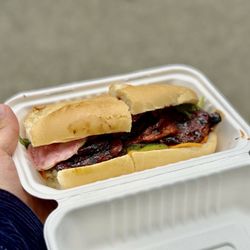 Saiguette - Classic bánh mí - roast pork, pork terrine, pate, cucumber, pickle carrots and jalapeño in home baked bread