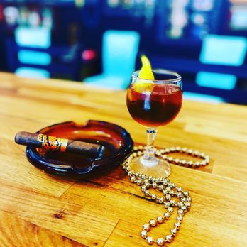 The Cigar Vault - a cigar and a glass of wine - Cigar Bars Near Me - Pacific, Missouri
