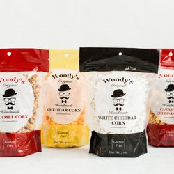 Woody's Popcorn - Our four classic flavors: caramel corn, cheddar corn, white cheddar corn, and caramel and cheddar mix.