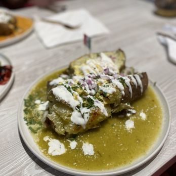 Quiero Brunch - Loaded breakfast potato with verde salsa. - Mexican Near Me - Temecula, California Quiero Brunch - Loaded breakfast potato with verde salsa. - Mexican Near Me - Temecula, California