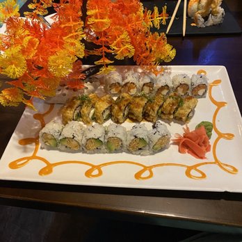 Sushi Yama - a plate of sushi and a vase of flowers - Sushi Bars Near Me - Middletown, Delaware Sushi Yama - a plate of sushi and a vase of flowers - Sushi Bars Near Me - Middletown, Delaware