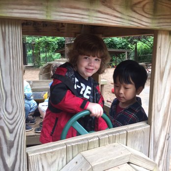 Lindgren School And Camp - Playing outside on the wooden train - Elementary Schools Near Me - Closter, New Jersey