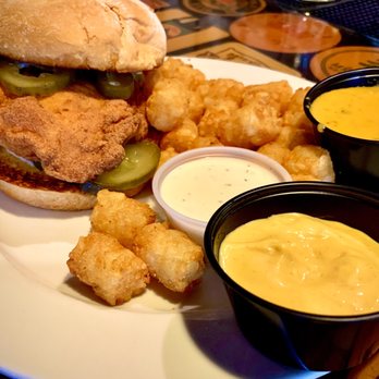 Coasters Pub & Biergarten - Georgia fried chicken sandwich with tots beer cheese dip and honey mustard. - Pubs Near Me - Melbourne, Florida