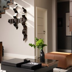 NZ Design & Construction - Sculptural art, natural light and thoughtful furniture placement transform circulation areas into intentional moments within the home.