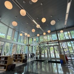 Miami-Dade Public Library System - Northeast Branch - Main entrance. Small book sale section in corner.