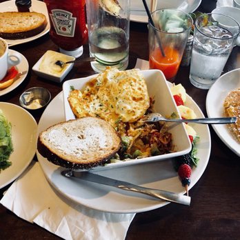 Eggstasy - Strawberry OJ, roasted veggie skillet with overhard eggs and buttermilk pancakes. - Breakfast & Brunch Near Me - Scottsdale, Arizona