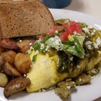 Imola Cafe - Chili Verde omelet with country potatoes and wheat toast. - Diners Near Me - Napa, California Imola Cafe - Chili Verde omelet with country potatoes and wheat toast. - Diners Near Me - Napa, California