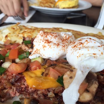 Red Cafe - Corn beef hash with a meaty omelet in the background! - Diners Near Me - San Francisco, California Red Cafe - Corn beef hash with a meaty omelet in the background! - Diners Near Me - San Francisco, California
