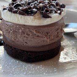 Amici's Restaurant - Triple Chocolate Mousse three layers of delicate white, milk, and dark chocolate mousse over a chocolate genoise cake