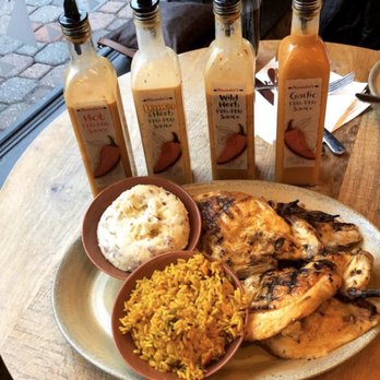 Nando's Peri-Peri - Full platter with sides - Portuguese rice and red skin mashed potatoes - South African Near Me - Arlington, Virginia Nando's Peri-Peri - Full platter with sides - Portuguese rice and red skin mashed potatoes - South African Near Me - Arlington, Virginia