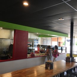two people standing at the counter two people standing at the counter