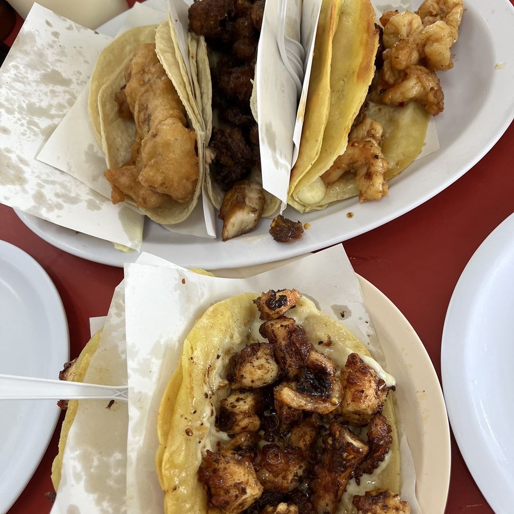Fish, chicharron, shrimp, and octopus tacos Fish, chicharron, shrimp, and octopus tacos