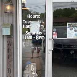Little Pigs BBQ Restaurant - Entrance with hours