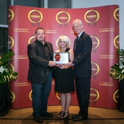 3 for 1 Glasses - Optician Micheal Friday accepting the Consumer's Choice Award