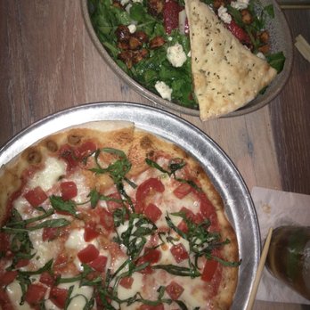 Moku Kitchen - Margherita pizza and watercress salad - Cocktail Bars Near Me - Honolulu, Hawaii Moku Kitchen - Margherita pizza and watercress salad - Cocktail Bars Near Me - Honolulu, Hawaii