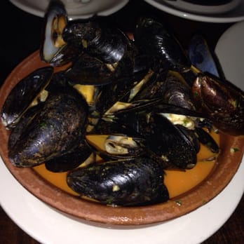 Nai  - Mussels in white wine sauce...tasty mussel meat was tiny - Tapas/Small Plates Near Me - New York, New York