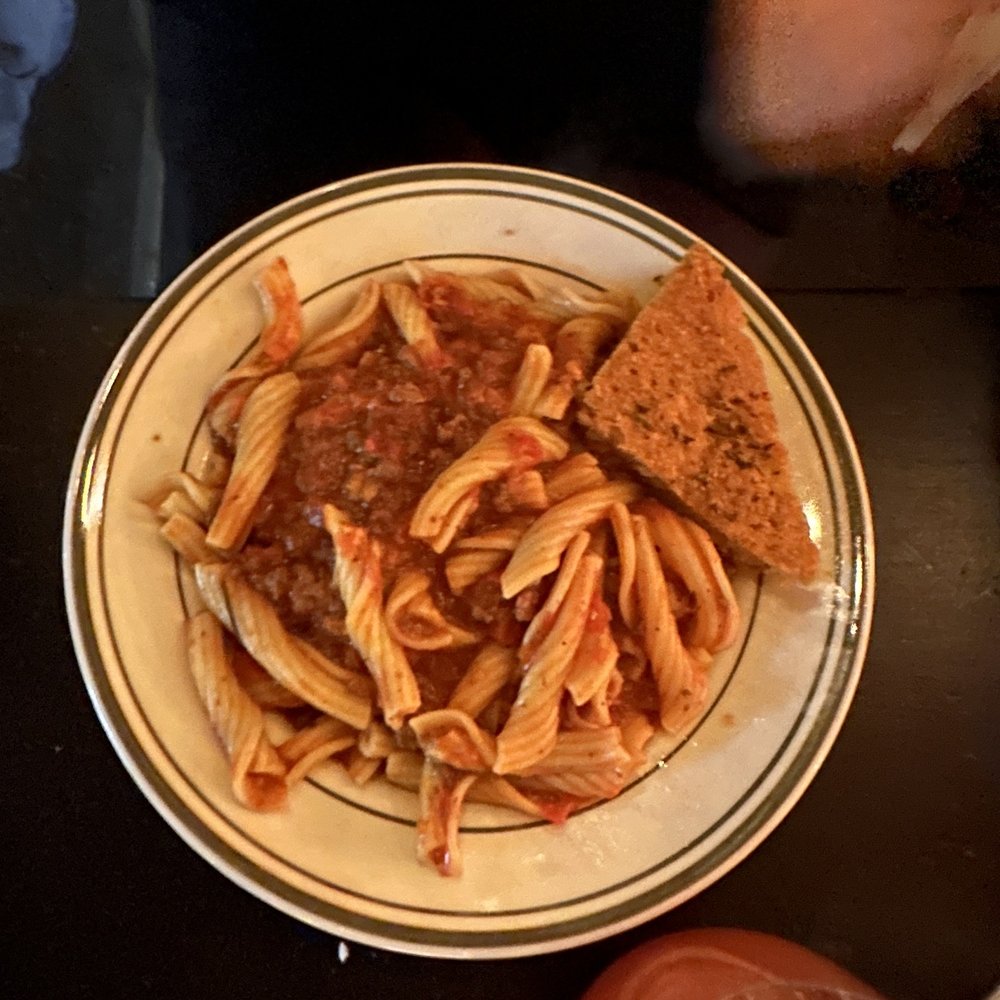WILD - a plate of pasta and bread on a table - New American Near Me - New York, New York