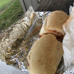 two sandwiches wrapped in foil