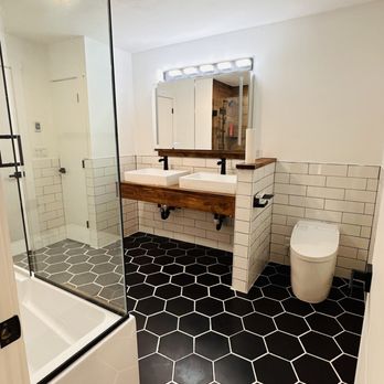 MCE General Contractor - a bathroom with black and white tile - General Contractors Near Me MCE General Contractor - a bathroom with black and white tile - General Contractors Near Me