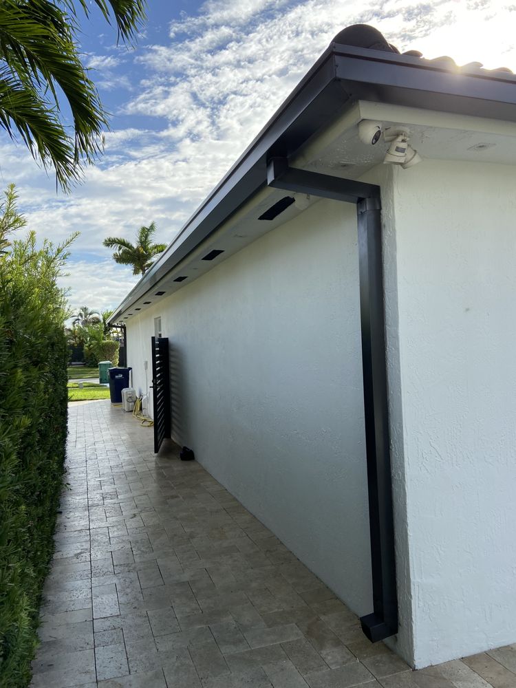 Slide of Jad Rain Gutters