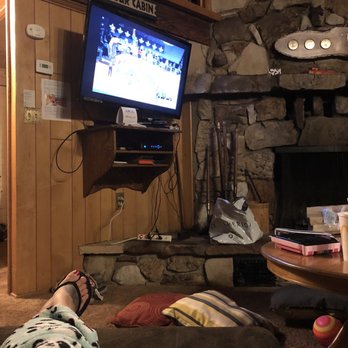 Big Bear Cool Cabins - Chillin on recliner watching tv - Property Management Near Me - Big Bear Lake, California
