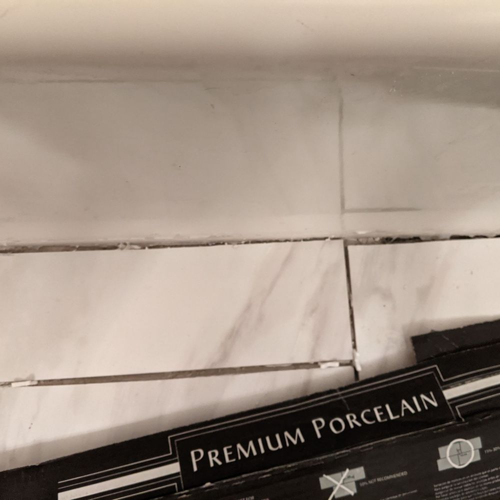 Romanoff Renovations - Uneven cuts along the bathtub again - Flooring Near Me - Ashland, Virginia Romanoff Renovations - Uneven cuts along the bathtub again - Flooring Near Me - Ashland, Virginia