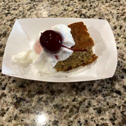 D' Road Cafe - Desert..similar to banana bread with whipped cream and a cherry on top