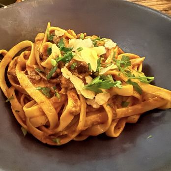 Revolution Winery & Kitchen - SHORTRIB PASTA: braised shortrib ragu, fettuccine, Parmigiano-Reggiano, fresh herbs - Vegan Near Me - Sacramento, California