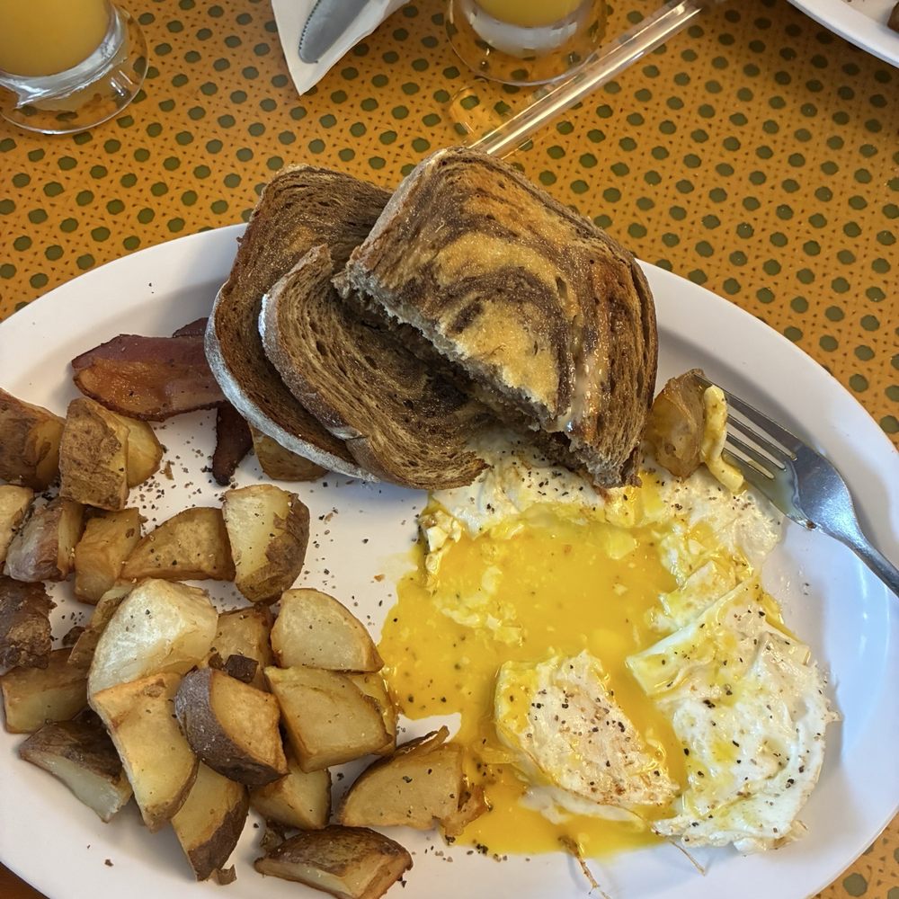 Rye Toast, over easy eggs, Bacon, Home Fries, Mimosas Rye Toast, over easy eggs, Bacon, Home Fries, Mimosas