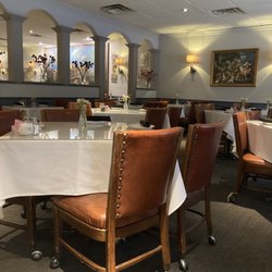 Cafe Amore - Tables with nice rolling chairs & fresh flowers!