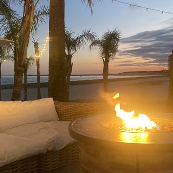 The Gulf - One of the fire pit areas with comfy seating. - Burgers Near Me - Orange Beach, Alabama