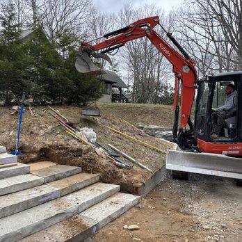Custom Masonry Solutions - Using a mini escavator to set steps. - Masonry/Concrete Near Me - Asheville, North Carolina