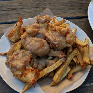 Photo of Lost & Found Beer Garden - Oakland, CA, United States. Poutine - 2.5 stars. Soggy, cold, and the cheese curds were too chunky (I've had the real thing in Canada!). Sun afternoon 2017-12-17