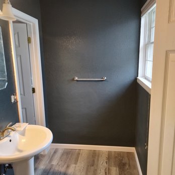 Marchs Home Improvement - a bathroom with wood flooring - General Contractors Near Me Marchs Home Improvement - a bathroom with wood flooring - General Contractors Near Me