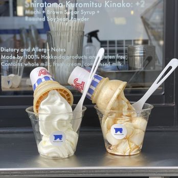 Indigo Cow - Plain (left), shiratama kuromitsu kinaka topping (right) - Ice Cream & Frozen Yogurt Near Me - Seattle, Washington Indigo Cow - Plain (left), shiratama kuromitsu kinaka topping (right) - Ice Cream & Frozen Yogurt Near Me - Seattle, Washington