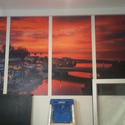 The Daily Grind Coffee & Bottle Shop - Sunrise over Stockton Bridge in Capitola by Neal Simmons.