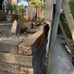 Brothers Landscaping - Top tier in front of the large fence. 50' long.