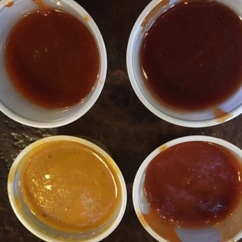 Central BBQ - Sauces available to add to your meats - hot, mild, mustard, and vinegar. All very good for different uses. - Barbeque Near Me - Memphis, Tennessee Central BBQ - Sauces available to add to your meats - hot, mild, mustard, and vinegar. All very good for different uses. - Barbeque Near Me - Memphis, Tennessee