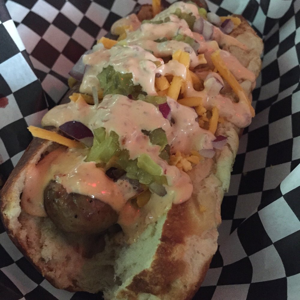 Moon Tower - Duck dog with the ancho chile Dr. Pepper onion topping - Dive Bars Near Me - Houston, Texas Moon Tower - Duck dog with the ancho chile Dr. Pepper onion topping - Dive Bars Near Me - Houston, Texas