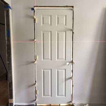 RJT Carpentry & Tile - a door being installed - General Contractors Near Me - Boston, Massachusetts RJT Carpentry & Tile - a door being installed - General Contractors Near Me - Boston, Massachusetts
