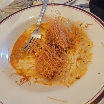 Carlyle - Shrimp and crab fritters. It comes with 3 but we dove in before we snapped the picture.  My favorite! - New American Near Me - Arlington, Virginia