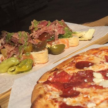 Mama Rosa's Trattoria - Prosciutto (two of four shown) and tre salami pizza - Pizza Near Me - Temecula, California Mama Rosa's Trattoria - Prosciutto (two of four shown) and tre salami pizza - Pizza Near Me - Temecula, California