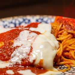 Roma's Italian Kitchen - Chicken Parmesan - Panko crusted chicken, topped with mozzarella cheese and Roma's red sauce over linguine at Roma's Italian Kitchen.