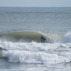 Wind and Wave Watersports - Frank the owner surfing Bob Hall Pier