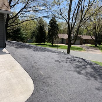 Blacktop Pro's - a driveway with a tree in the background - General Contractors Near Me - st paul, Minnesota