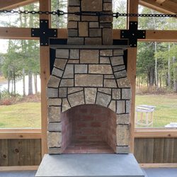 Granville Stone & Hearth - Wood Fireplace with natural stone veneer.