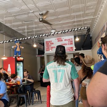 Barbs B Q - Inside - we were in line at 12:45. Not too bad! Hopefully there is food left...appears to be! - Barbeque Near Me - Lockhart, Texas