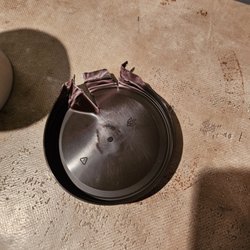 Lid after using pliers and a box cutter to open the container