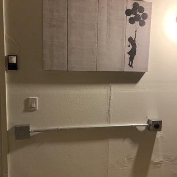 A-EV Installs - NEMA 14-50 in the garage. The laundry room is on the other side of the wall where the panel is located. - Electricians Near Me